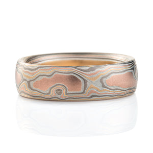 japanese craft men's mokume gane ring made to look like wood grain, made with red gold, yellow gold, palladium and etched silver.