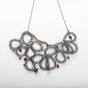 garnets woven into wire lacy oxidized wire 